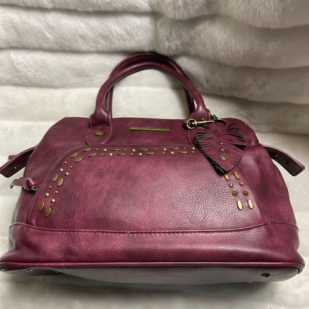 Steve Madden burgundy faux leather satchel with rustic studs accent.